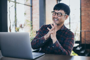 Asian man smiling accepted for job interview
